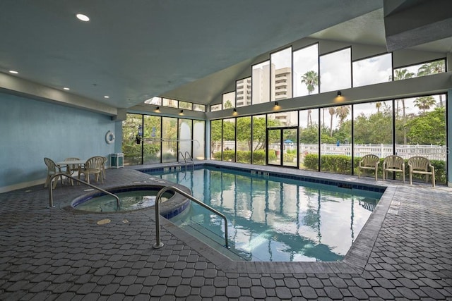 view of pool with a pool with connected hot tub