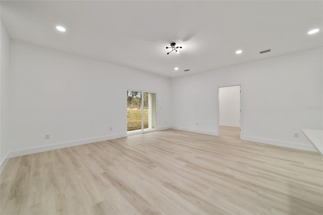 unfurnished room with light wood finished floors, recessed lighting, and baseboards