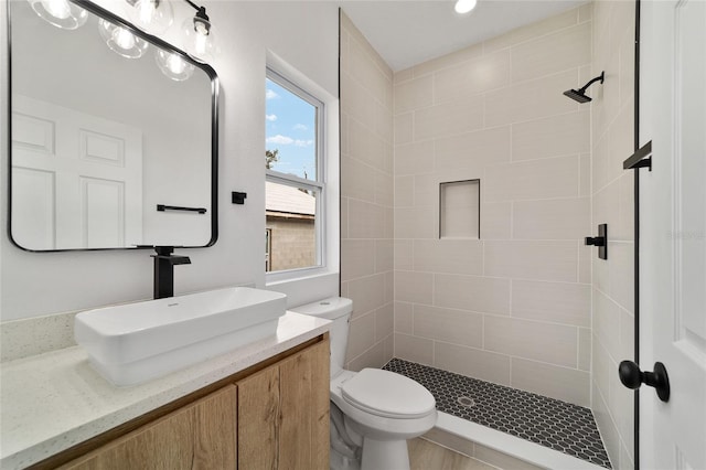 full bath featuring a shower stall, toilet, and vanity