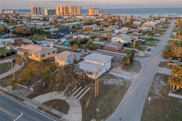 birds eye view of property featuring a view of city and a water view