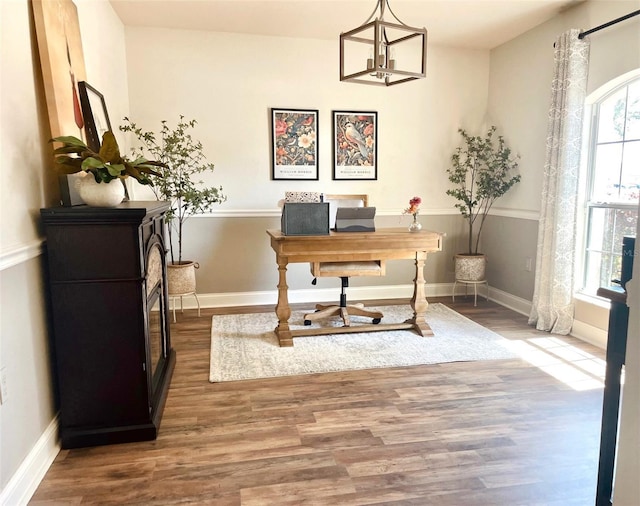 office featuring baseboards and wood finished floors