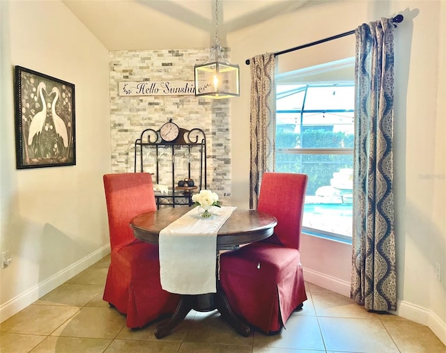 tiled dining room with baseboards