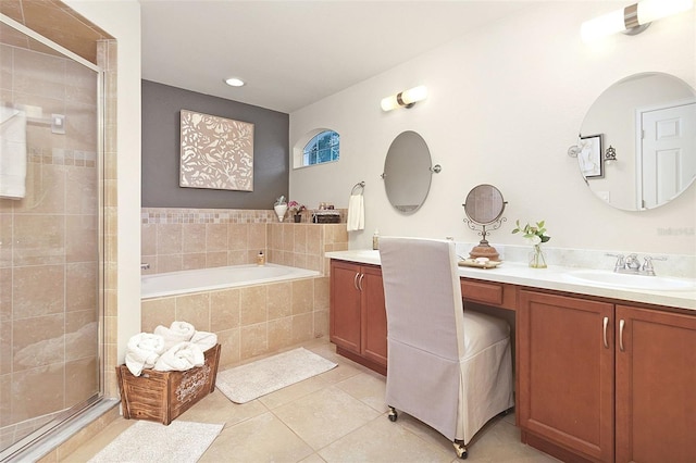 full bath with vanity, tile patterned floors, a bath, and a shower stall