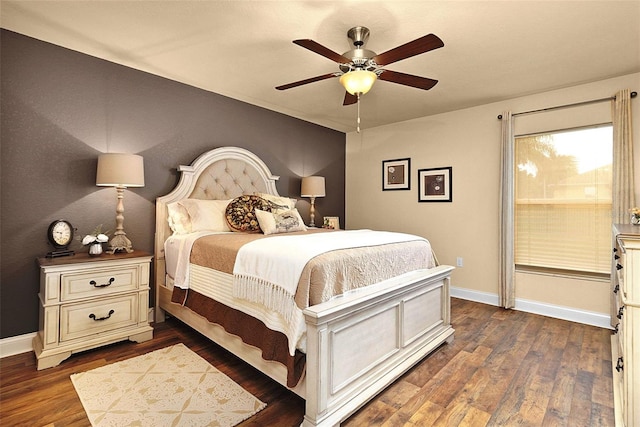 bedroom with baseboards, dark wood finished floors, and a ceiling fan