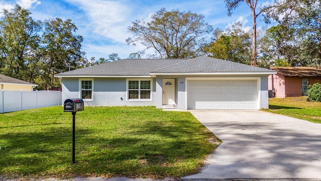 single story home featuring a garage, driveway, fence, a front lawn, and stucco siding