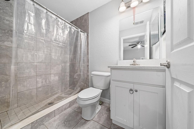 bathroom with toilet, vanity, visible vents, and a shower stall