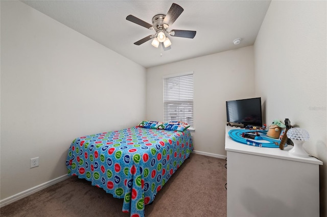 bedroom featuring a ceiling fan, light colored carpet, and baseboards