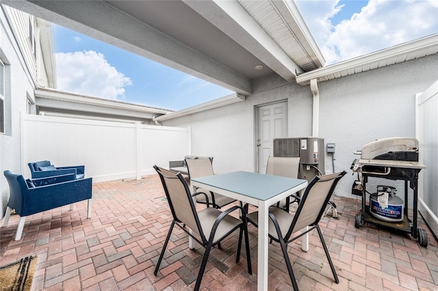 view of patio / terrace featuring outdoor dining space, a fenced backyard, and area for grilling