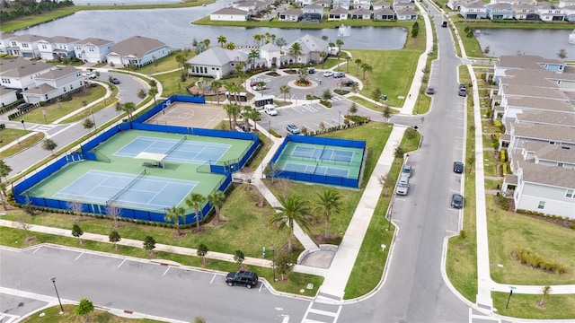 drone / aerial view with a water view and a residential view