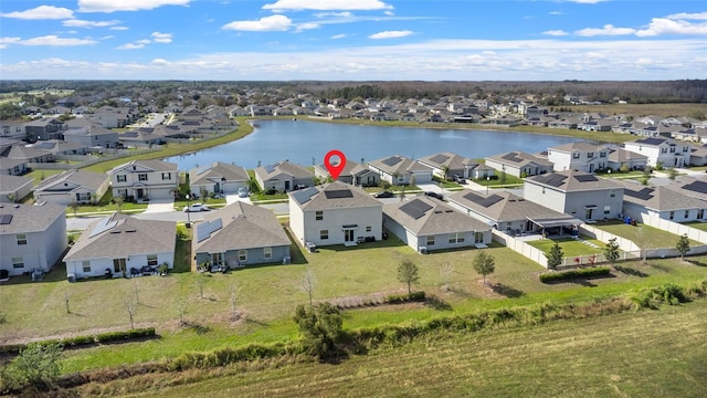 bird's eye view featuring a water view and a residential view