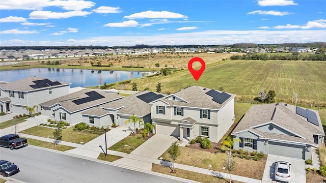 bird's eye view with a water view and a residential view