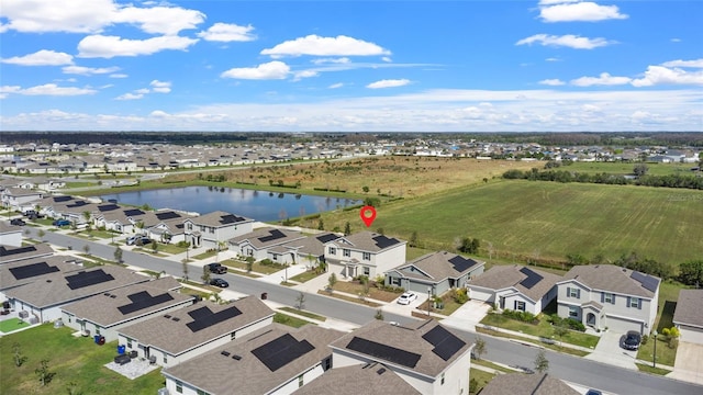 bird's eye view with a residential view and a water view