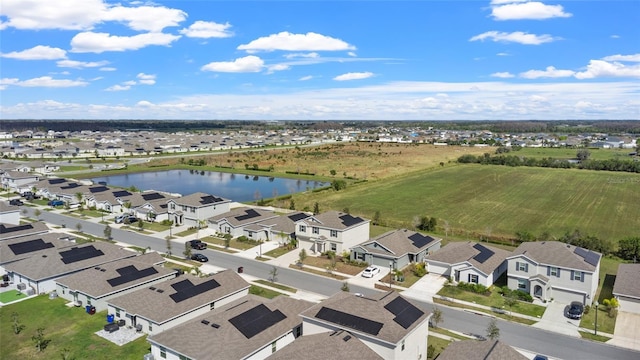 aerial view featuring a water view and a residential view