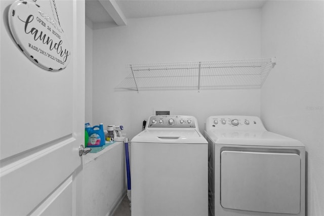 clothes washing area featuring laundry area and independent washer and dryer