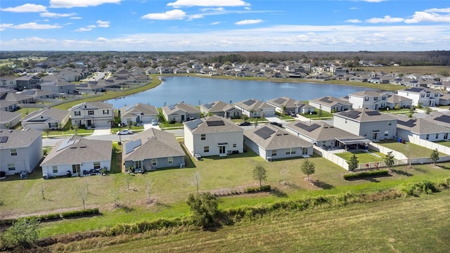 birds eye view of property with a water view and a residential view