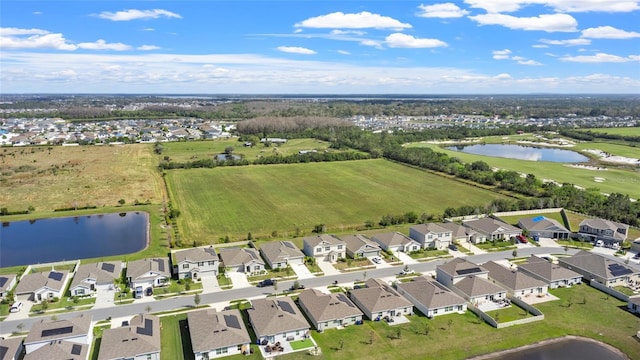 bird's eye view featuring a water view and a residential view