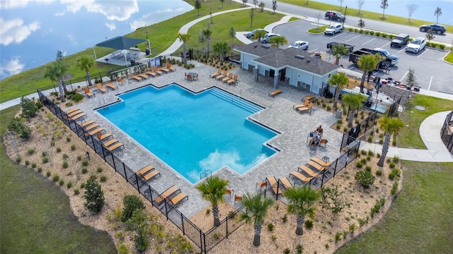 pool featuring a patio area and fence