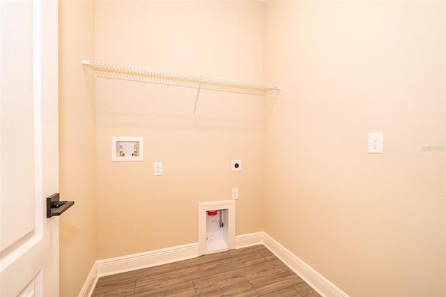 washroom with laundry area, baseboards, wood finished floors, hookup for a washing machine, and electric dryer hookup