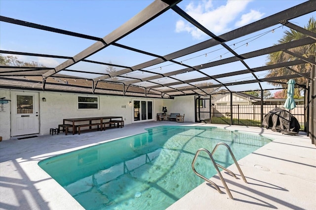 view of swimming pool featuring a fenced in pool, glass enclosure, a patio area, and fence