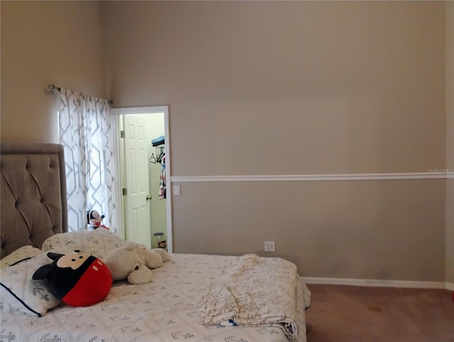 bedroom with carpet and baseboards