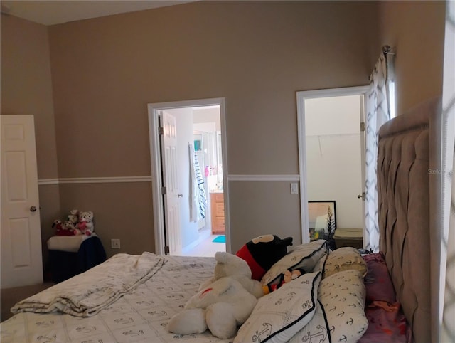 bedroom featuring a closet and ensuite bathroom