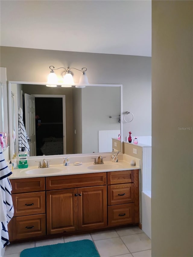 bathroom with tile patterned flooring, double vanity, and a sink