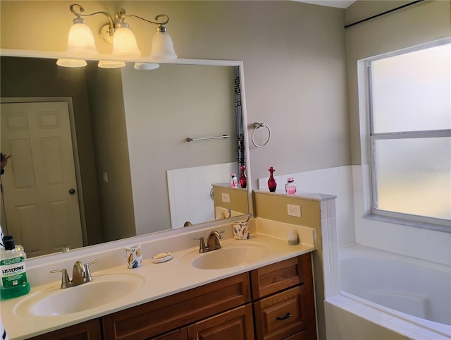 full bathroom featuring double vanity, a bath, and a sink