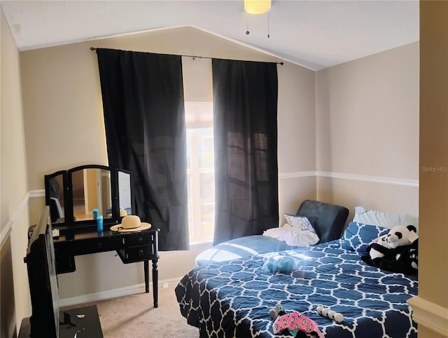 carpeted bedroom with vaulted ceiling