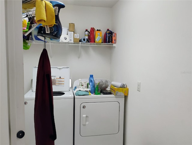 washroom with washer and dryer and laundry area