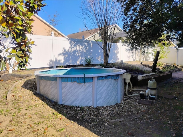 view of swimming pool with a fenced in pool and a fenced backyard