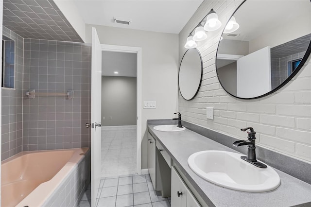 bathroom with double vanity, tile patterned flooring, a sink, and visible vents