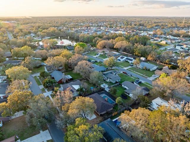 bird's eye view featuring a water view and a residential view