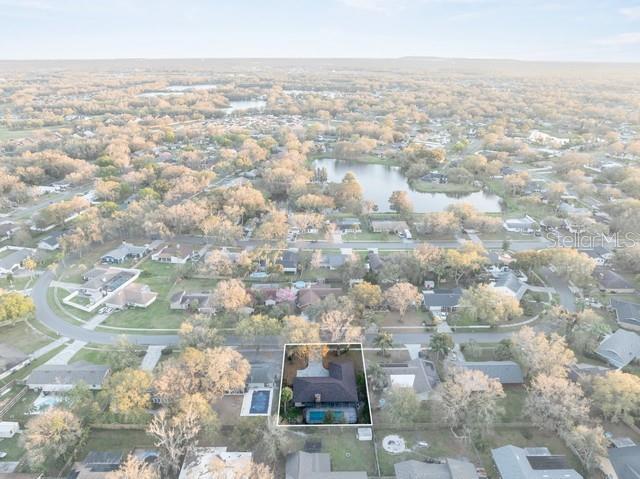 bird's eye view with a water view and a residential view