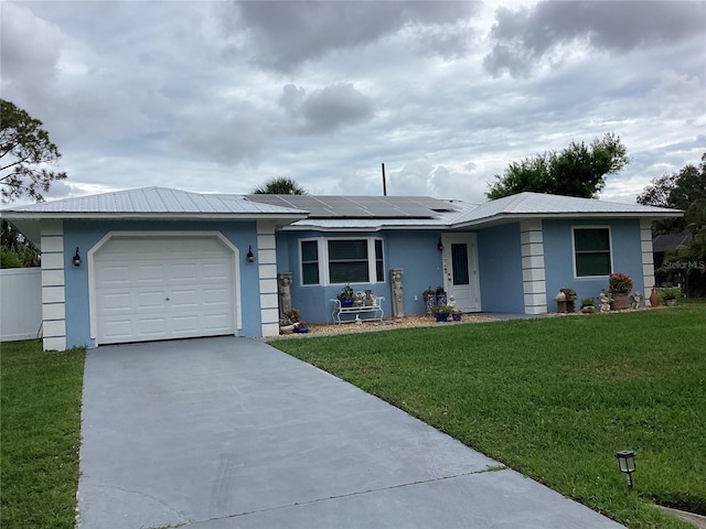 ranch-style house featuring concrete driveway, an attached garage, a front lawn, and stucco siding