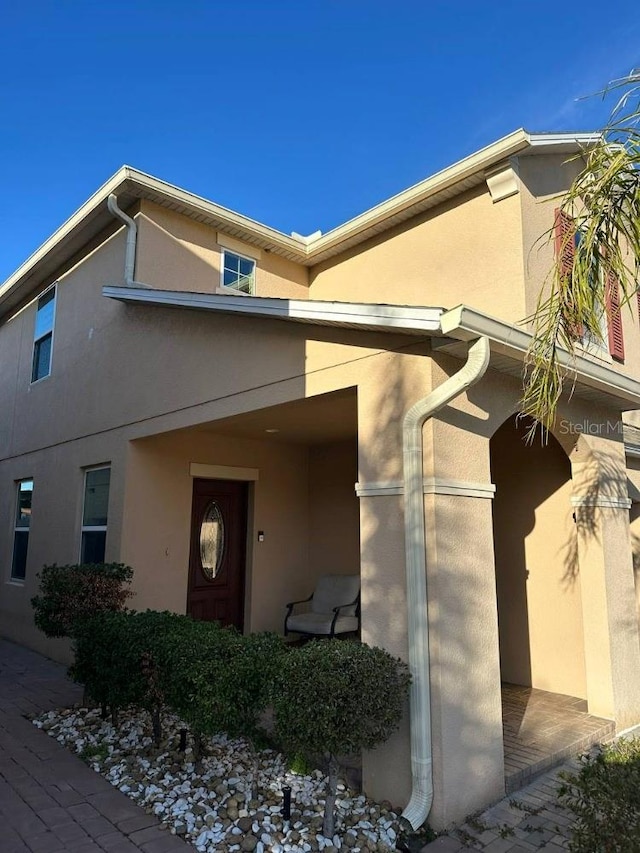 exterior space with stucco siding