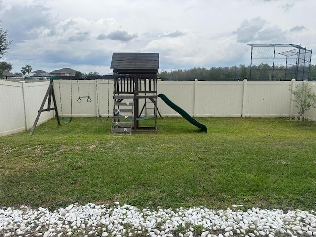 view of play area featuring a fenced backyard and a yard