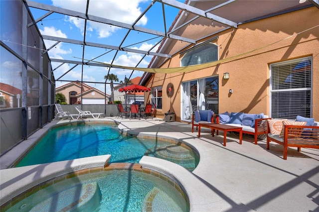 view of pool with a pool with connected hot tub, a patio, a lanai, and an outdoor hangout area