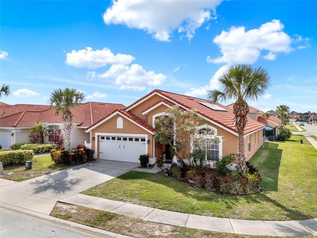 view of front facade with a garage, a tiled roof, driveway, stucco siding, and a front yard