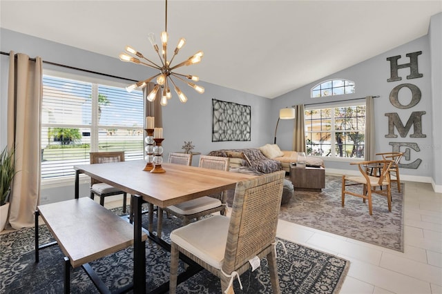 dining space featuring an inviting chandelier, light tile patterned floors, baseboards, and vaulted ceiling