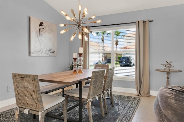 dining space with lofted ceiling, an inviting chandelier, light tile patterned floors, and baseboards