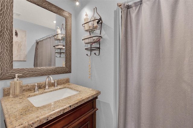 bathroom with vanity, visible vents, and a shower with curtain