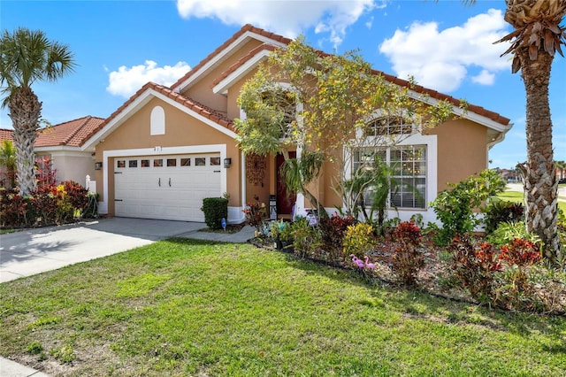 view of front facade featuring concrete driveway, a tiled roof, an attached garage, a front lawn, and stucco siding