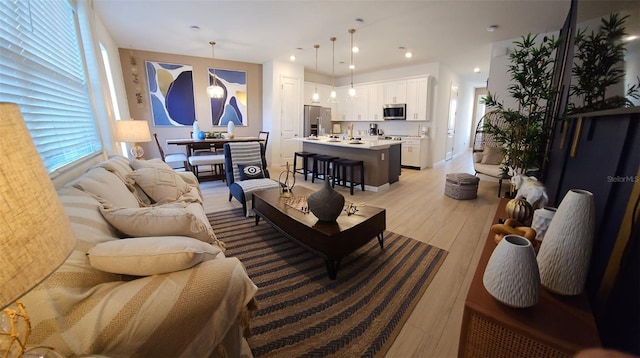 803 Longboat Dr, Davenport, FL 33896 - living area with light wood-style floors