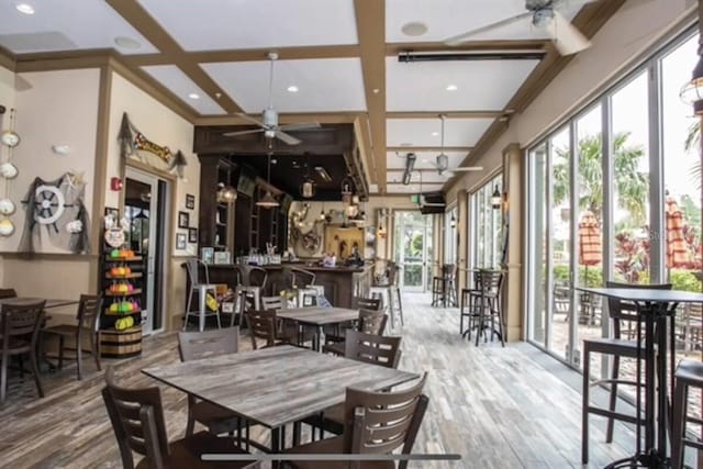 803 Longboat Dr, Davenport, FL 33896 - dining area with ceiling fan, wood finished floors, coffered ceiling, recessed lighting, and beam ceiling