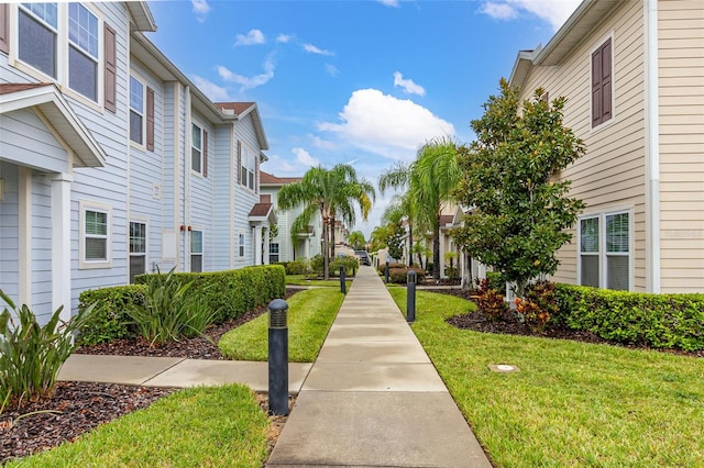 view of community with a yard and a residential view