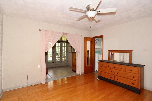 unfurnished room with a ceiling fan and wood finished floors