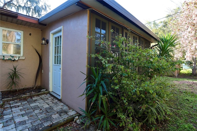 view of property exterior with stucco siding