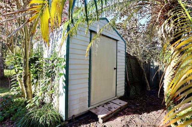 view of shed with a fenced backyard