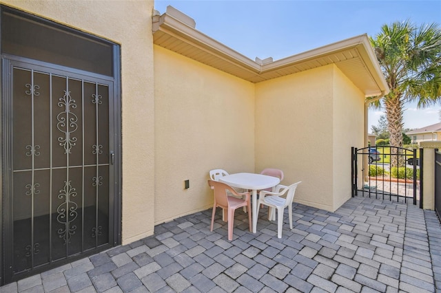 3390 Fallbrook Dr, Kissimmee, FL 34759 - view of patio with outdoor dining space and a gate