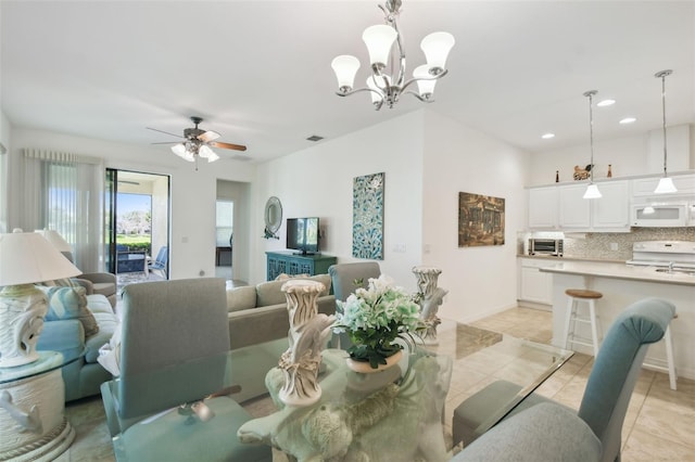 3390 Fallbrook Dr, Kissimmee, FL 34759 - dining space with light tile patterned floors, recessed lighting, visible vents, and ceiling fan with notable chandelier
